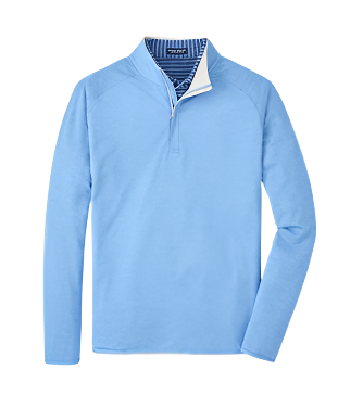 The Peter Millar Stealth Performance Quarter Zip is a light blue, long-sleeved pullover with a quarter-zip, contrasting striped inner collar, and four-way stretch for comfort.