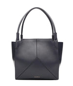 A Small Victoria Tote by Victoria Beckham in black smooth calf leather, featuring double handles, geometric stitching, and small gold text near the lower center, shown on a plain white background.
