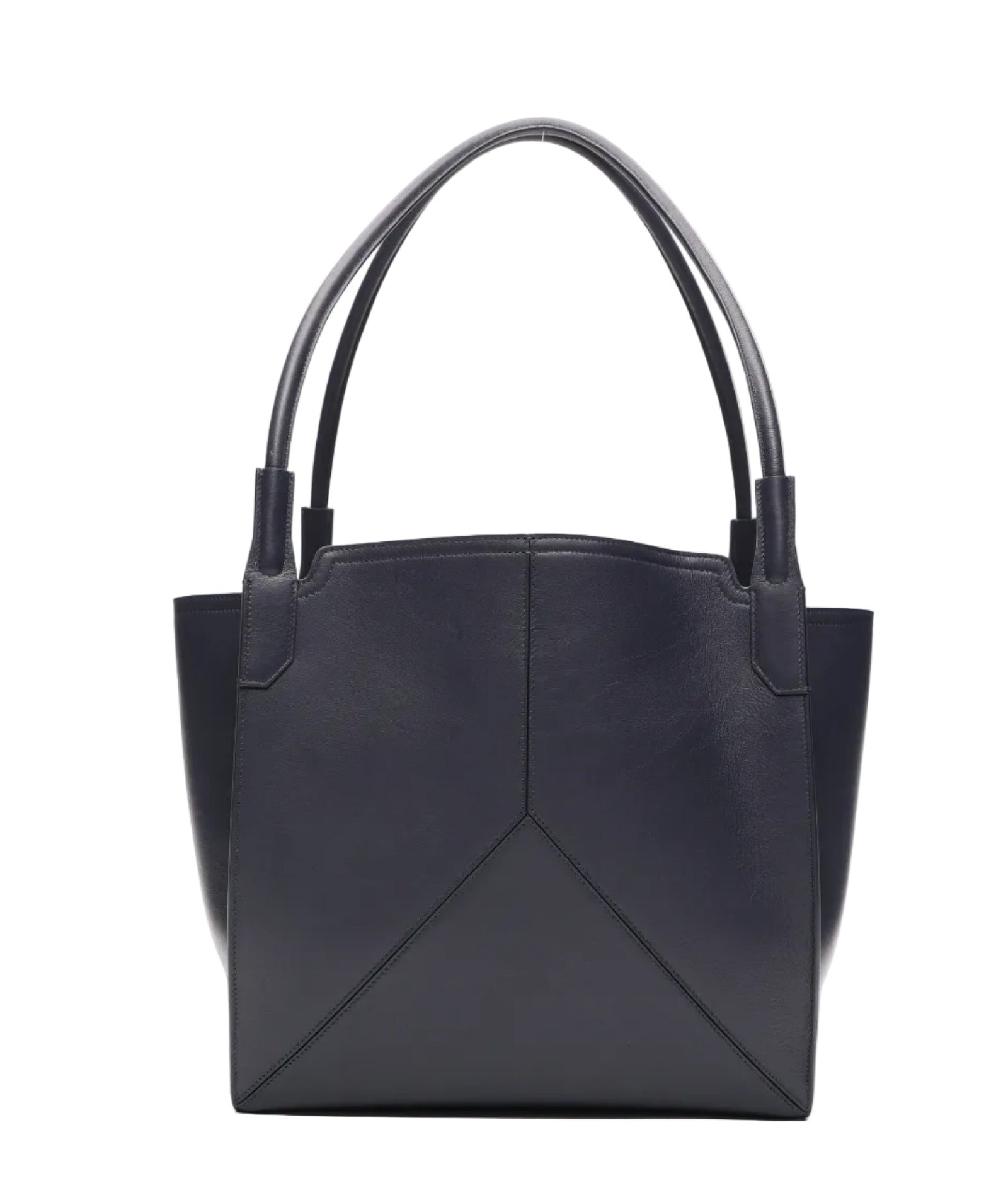 The Small Victoria Tote by Victoria Beckham, crafted in smooth navy calf leather with double handles, simple stitching, and a geometric front panel design, is shown against a white background.
