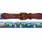 Smathers & Branson Island Time Belt, featuring a colorful seaside village pattern with palm trees and sailboats, complemented by a brown leather buckle.