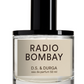 A 50 ml bottle of D.S. & DURGA Radio Bombay eau de parfum showcases a black cap and minimalist label, evoking the warm notes of sandalwood and musk, reminiscent of an old transistor radio's soothing hum.