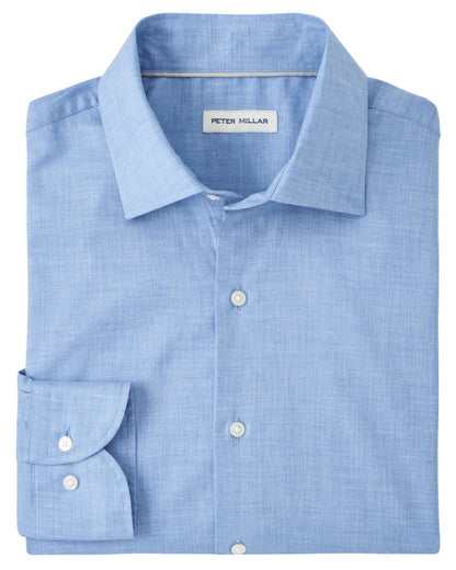 A neatly folded Highlands Soft Twill Cotton Sport Shirt in light blue with a spread collar and a visible Peter Millar label.