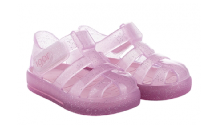 The Igor Girls' Star Jelly Sandal features translucent pink PVC with glitter and Velcro straps, shown side by side.