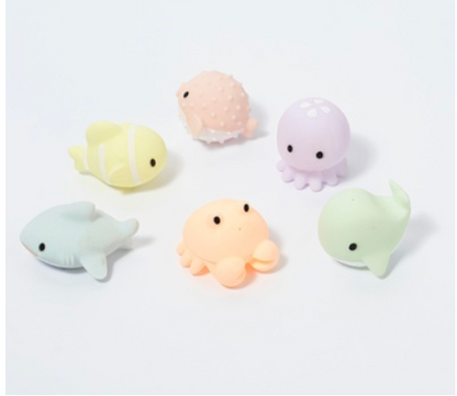 Six small, pastel-colored Sunnylife Sea Animal Splash Toys, including a fish, pufferfish, octopus, shark, crab, and whale.