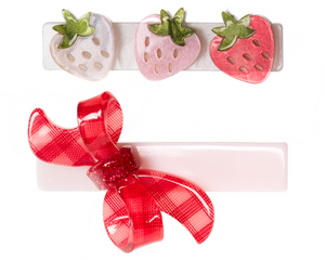 Add a playful touch to your look with Lillies & Roses’ Strawberry Pink Shades & Checker Bow Hair Clip set—one features three strawberry decorations in white, pink, and red, while the other boasts a pink clip adorned with a red plaid ribbon bow, making it a charming addition to your handmade hair accessories collection.