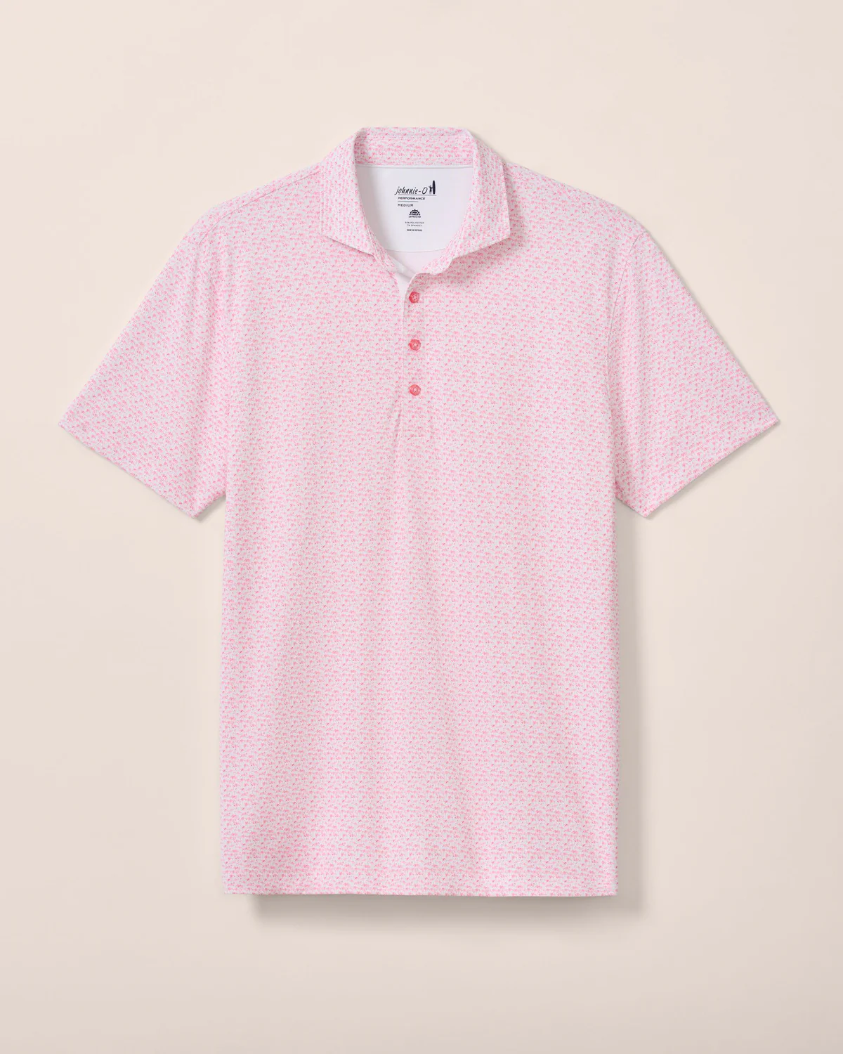The Johnnie-O Flock Yeah Performance Mesh Polo is a light pink, short-sleeve shirt with a subtle geometric pattern, crafted from performance fabric with a collar and three-button placket—perfect for upgrading your golf wardrobe.