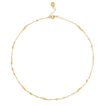 Anabel Aram Milos Multi Beaded Necklace, an 18k gold plated chain with scattered elongated and small spherical beads.