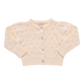 The Girls' Connie Sweater by Pink Chicken is a cream long-sleeve pointelle cardigan with glitter button-up front, ribbed cuffs and hem, shown flat on a white background—a classic style.