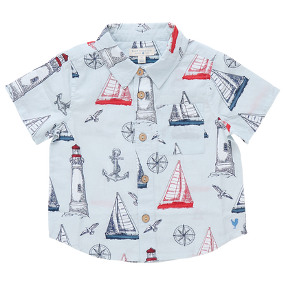 Pink Chicken Boys' Jack Shirt with a nautical print—sailboats, lighthouses, anchors, compasses, and seagulls in red and blue. Perfect short-sleeve shirt for little sailors' nautical adventures.