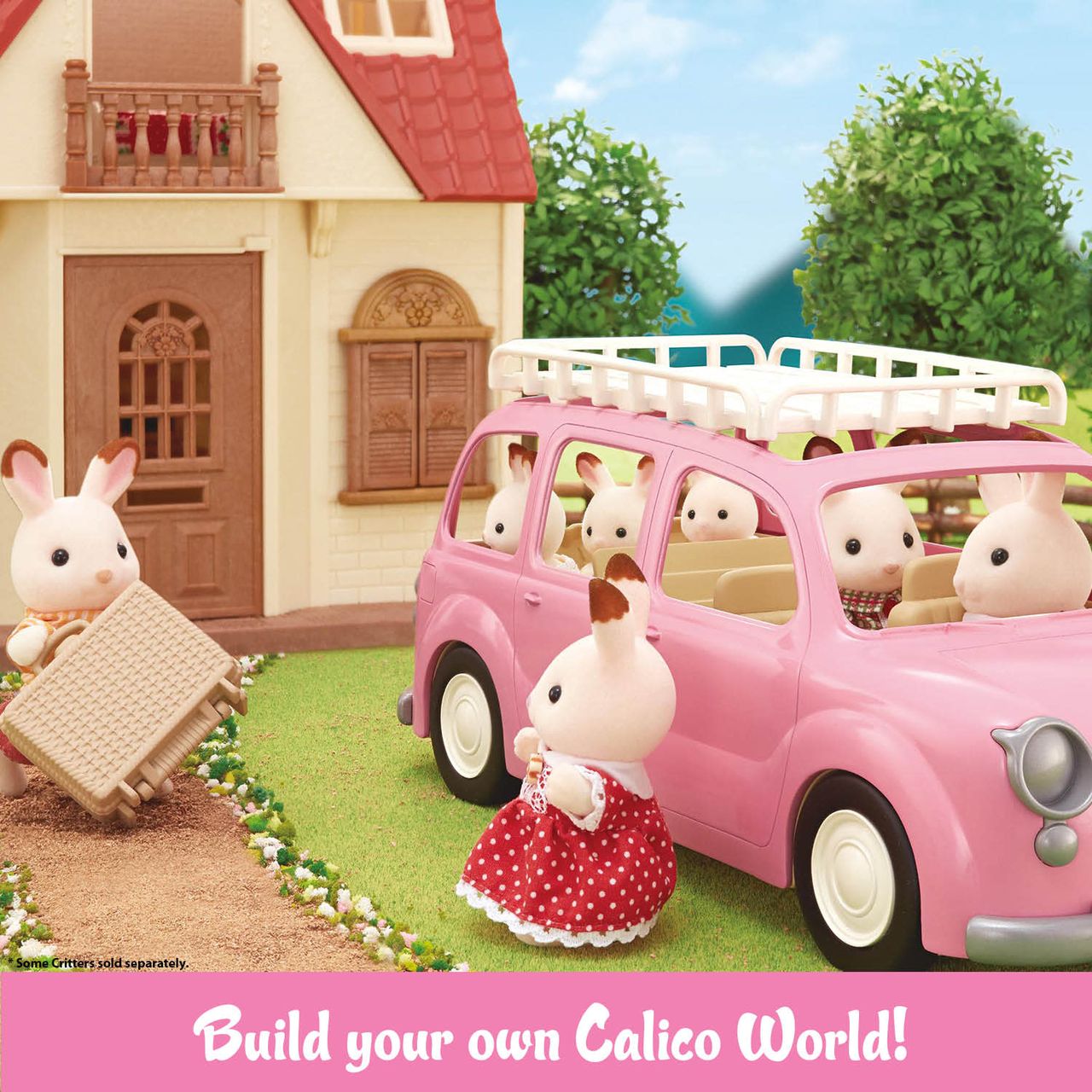 Calico Critters toy rabbit figures stand beside a pink Calico Critters Family Picnic Van and house, with one rabbit carrying luggage and picnic accessories. Text at the bottom reads, “Build your own Calico World!”.