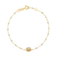 The Madone Charm Bracelet 6.7" by Gigi Clozeau features an 18-carat gold chain, elegant resin pearls, a central round gold charm, and a lobster clasp—a timeless accessory for any occasion.