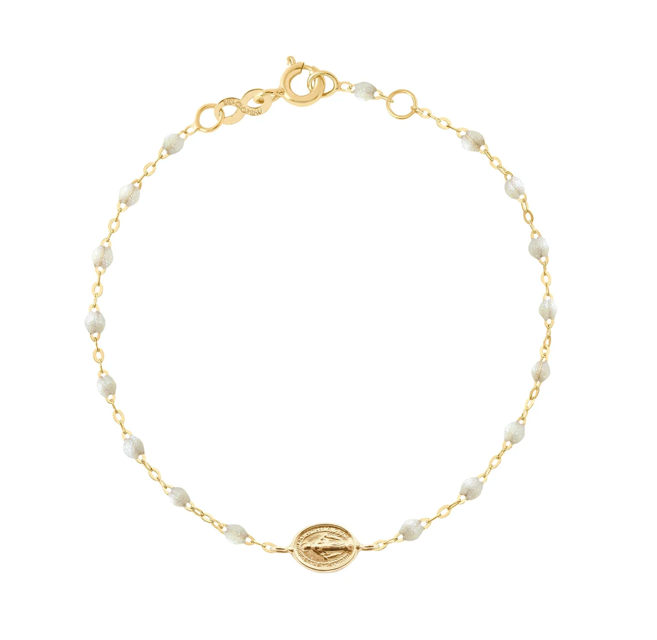 The Madone Charm Bracelet 6.7" by Gigi Clozeau features an 18-carat gold chain, elegant resin pearls, a central round gold charm, and a lobster clasp—a timeless accessory for any occasion.