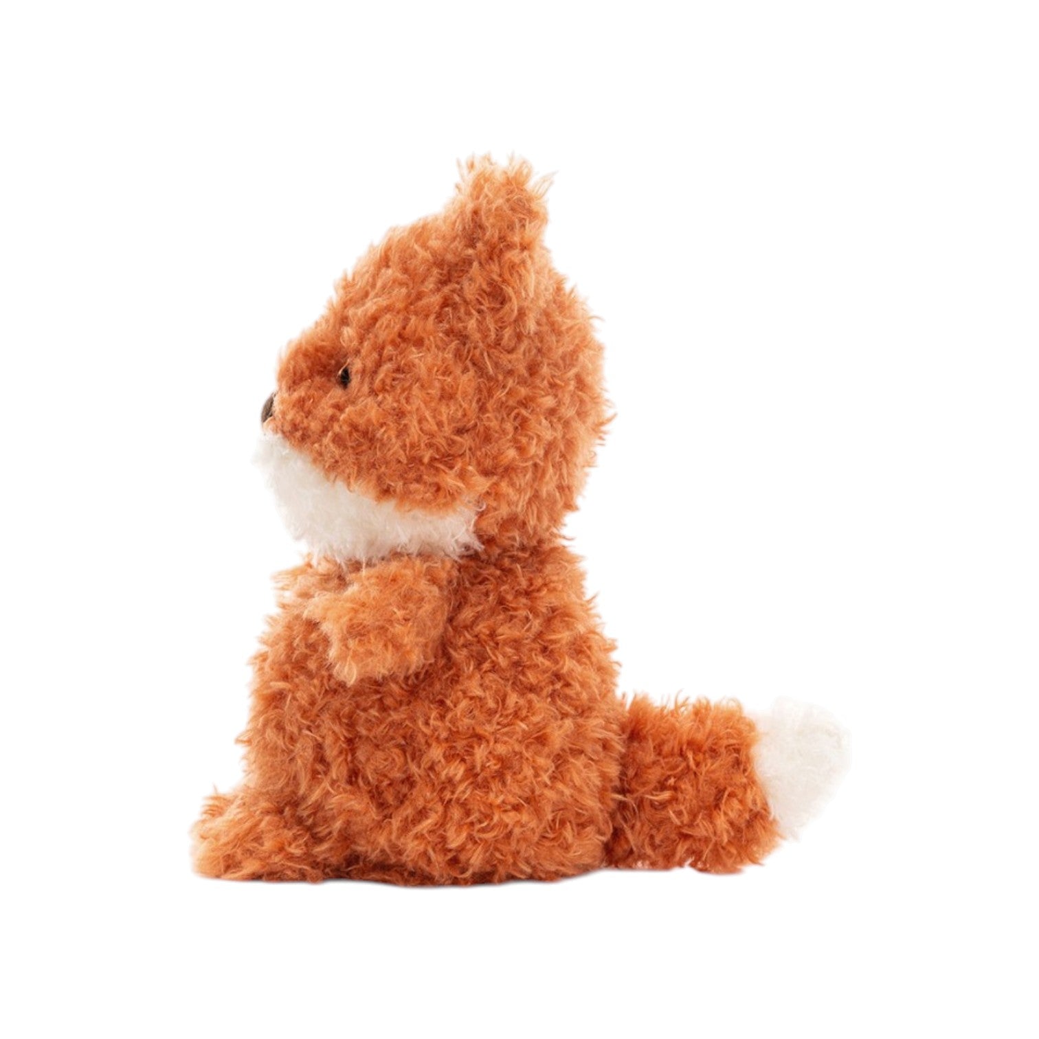 Jellycat’s Little Fox is shown in a side view, sitting upright with soft orange fur, a white snout, and a fluffy tail tipped with white, all set against a crisp white background.