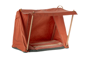 Maileg Happy Camper Tent - Mouse: This small orange fabric tent with an open front is supported by two rods and comes with a striped cushion inside—perfect for imaginative play or outdoor adventures—shown against a white background.