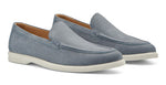 The Excursionist Nubuck Venetian Loafer by Peter Millar is a lightweight Brazilian loafer in light blue suede, featuring white rubber soles and tan interior lining, displayed against a white background.