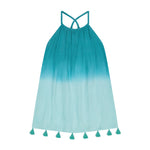 Girls’ Mini Chantal Dress by Mer in a sleeveless teal and light blue gradient design, featuring a strappy back and tassels along the hem, displayed on a white background.