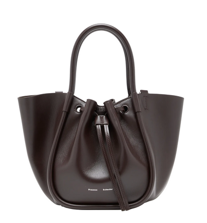 Small Ruched Soft Shiny Tote by Proenza Schouler in dark brown leather, featuring a sculptural silhouette, dual handles, ruched drawstring closure, and small white brand text at the bottom front.