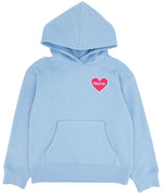 The Girls’ Hadley Bestie Hoody by Feather 4 Arrow is a light blue sweatshirt made from cozy fabric, featuring a front kangaroo pocket and a red heart patch on the chest that says “BESTIE.”.