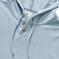 The Jase Hoodie by Johnnie-O features a light blue slub knit fabric, a drawstring hood, two brown buttons on the placket, and a white tag sewn inside the collar. Part of the Hangin’ Out collection, this cotton-blend hoodie combines comfort and style for everyday wear.