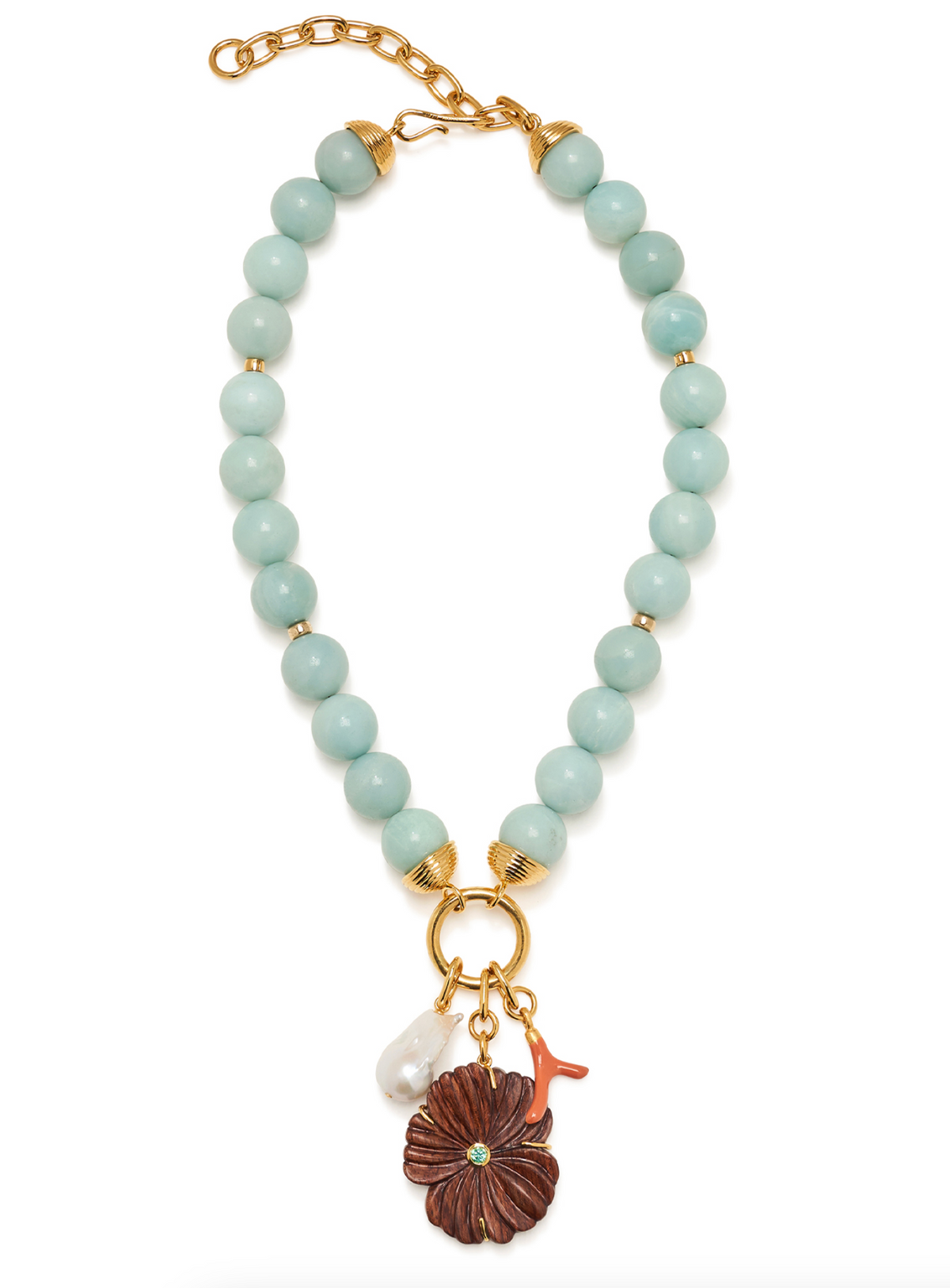 Lizzie Fortunato’s Desert Bloom Necklace showcases chunky aqua amazonite beads, gold-toned hardware, and three distinctive charms: a brown flower, a white pearl-like bead, and a petite red branch-shaped accent.