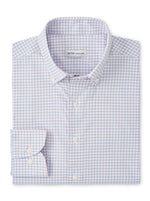 The Peter Millar Gregory Performance Twill Sport Shirt is a folded long-sleeve shirt with a light blue and pink checkered pattern, button-down collar, and is crafted from performance fabric for comfort.