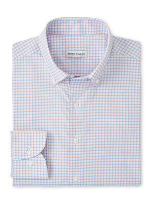 The Peter Millar Gregory Performance Twill Sport Shirt is a folded long-sleeve shirt with a light blue and pink checkered pattern, button-down collar, and is crafted from performance fabric for comfort.