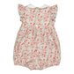 The Kidiwi Baby Girls' Julyne Smocked Girl Romper features short ruffled sleeves, a Peter Pan collar, back button closure, and a cream base with small red and pink floral patterns.