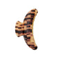 The Jumbo Heirloom Claw by Machete is a large claw clip in a brown and beige tortoiseshell pattern, crafted from premium Italian acetate with a sturdy spring mechanism—ideal for securing thick hair. Shown from the side on a white background.