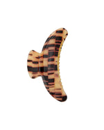 The Jumbo Heirloom Claw by Machete is a large claw clip in a brown and beige tortoiseshell pattern, crafted from premium Italian acetate with a sturdy spring mechanism—ideal for securing thick hair. Shown from the side on a white background.