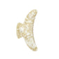 The Machete Jumbo Heirloom Claw is a large, cream-colored marbled hair clip crafted from premium Italian acetate. Featuring a curved, wing-like design, it is made to securely hold thick hair. The claw clip is displayed against a plain white background.