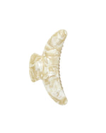 The Machete Jumbo Heirloom Claw is a large, cream-colored marbled hair clip crafted from premium Italian acetate. Featuring a curved, wing-like design, it is made to securely hold thick hair. The claw clip is displayed against a plain white background.