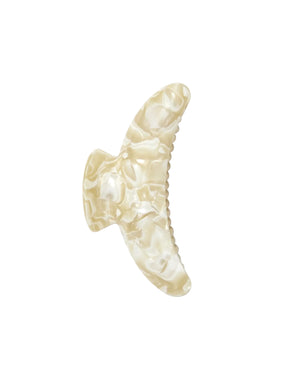 The Machete Jumbo Heirloom Claw is a large, cream-colored marbled hair clip crafted from premium Italian acetate. Featuring a curved, wing-like design, it is made to securely hold thick hair. The claw clip is displayed against a plain white background.