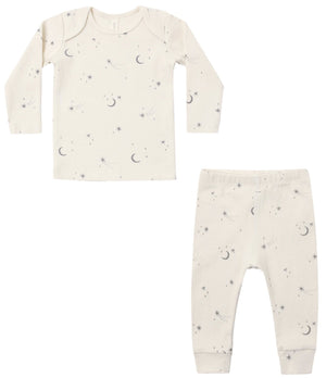Quincy Mae’s Baby and Kids’ Ribbed Tee + Legging Set features a cream-colored, slim-fit long sleeve top and matching pajama leggings adorned with moon and star patterns, crafted from soft organic rib knit fabric.