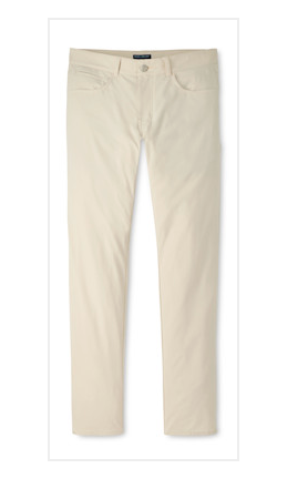 The Peter Millar Bingham Performance Five-Pocket Pant, shown here in light beige and featuring a slim fit, is expertly crafted from luxurious Italian knit fabric with both front and back pockets—these lightweight pants are displayed flat on a white background.