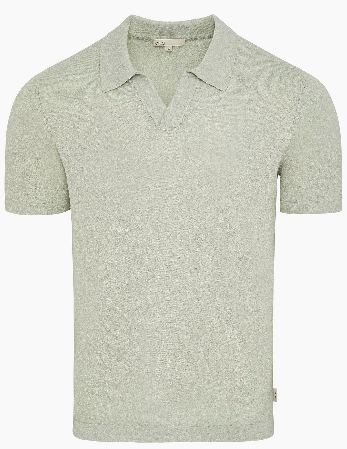 The Onia Boucle Knit Johnny Polo features a light green, short-sleeve design with an open V-neck and relaxed silhouette, displayed against a plain white background.
