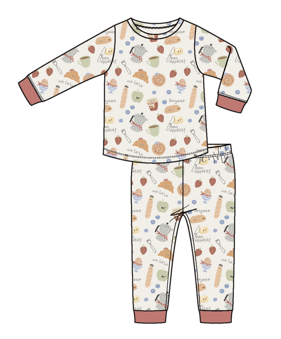Angel Dear Baby and Kids' Long Sleeve Loungewear Set features a pastel food print with bread, eggs, and utensils, plus pink cuffs and collar. Made from breathable fabric for cozy, all-night comfort.