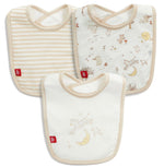 Introducing the Bedtime Rhymes Modal Bib 3-Pack by Magnetic Me: This set includes three absorbent baby bibs—one with beige stripes, one featuring animal and nature illustrations, and one showcasing a mouse on a moon. Each bib is crafted from soft, eco-friendly modal for gentle comfort and features beige trim with a red logo tag on the bottom left corner.