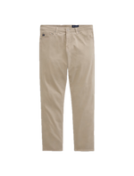 Showcased on a white background, the Tellis Sueded Sateen Jeans by AG Jeans are a pair of beige men’s pants crafted from stretch sateen fabric, featuring a modern slim jean silhouette with front and back pockets, belt loops, and a button closure.