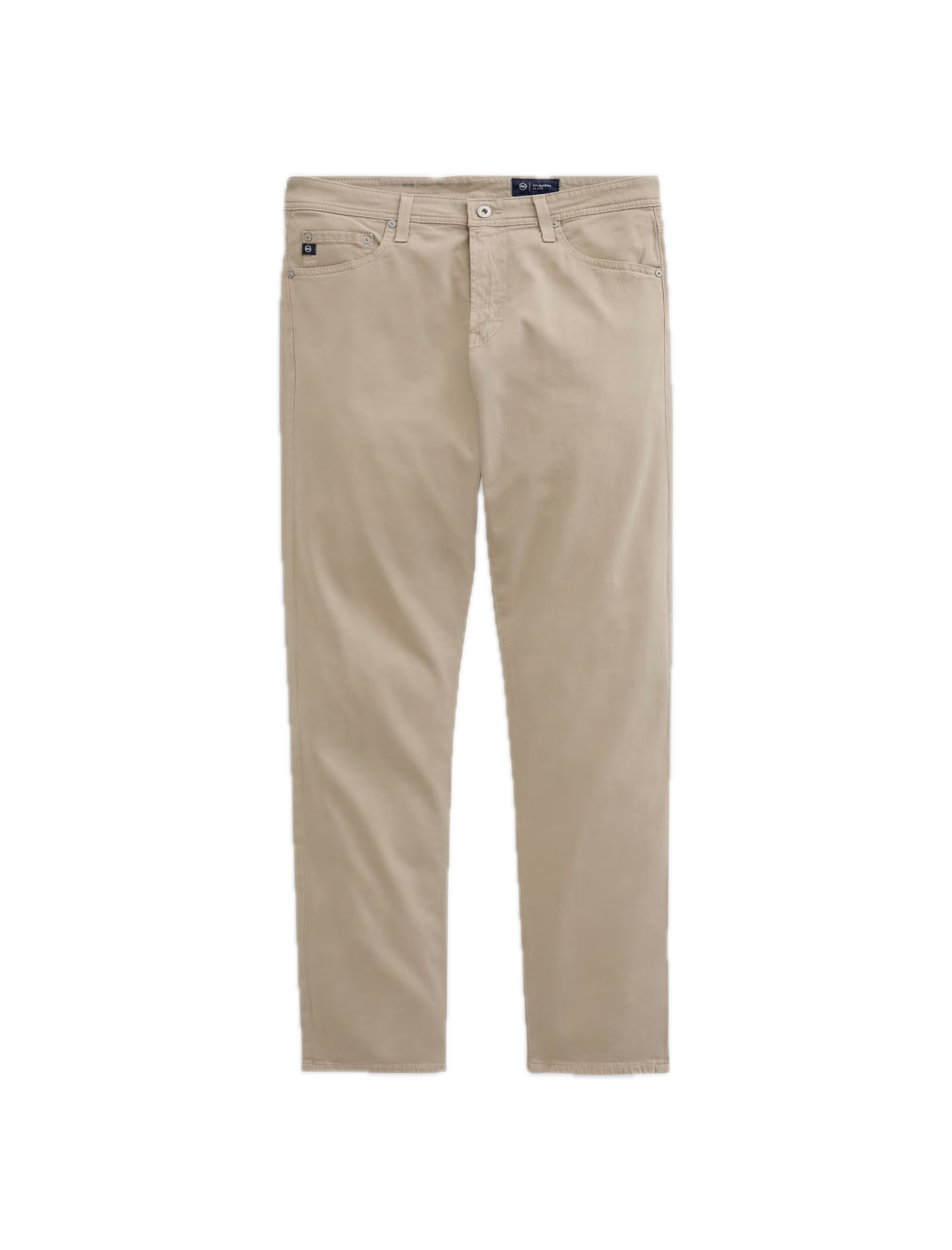 Showcased on a white background, the Tellis Sueded Sateen Jeans by AG Jeans are a pair of beige men’s pants crafted from stretch sateen fabric, featuring a modern slim jean silhouette with front and back pockets, belt loops, and a button closure.