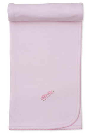 The Kissy Kissy Premier Elephant Esprit Blanket with Hand Emb. is a light pink Pima cotton baby blanket, featuring scalloped edges, delicate hand-embroidered pink elephants in one corner, and comes rolled at the top.