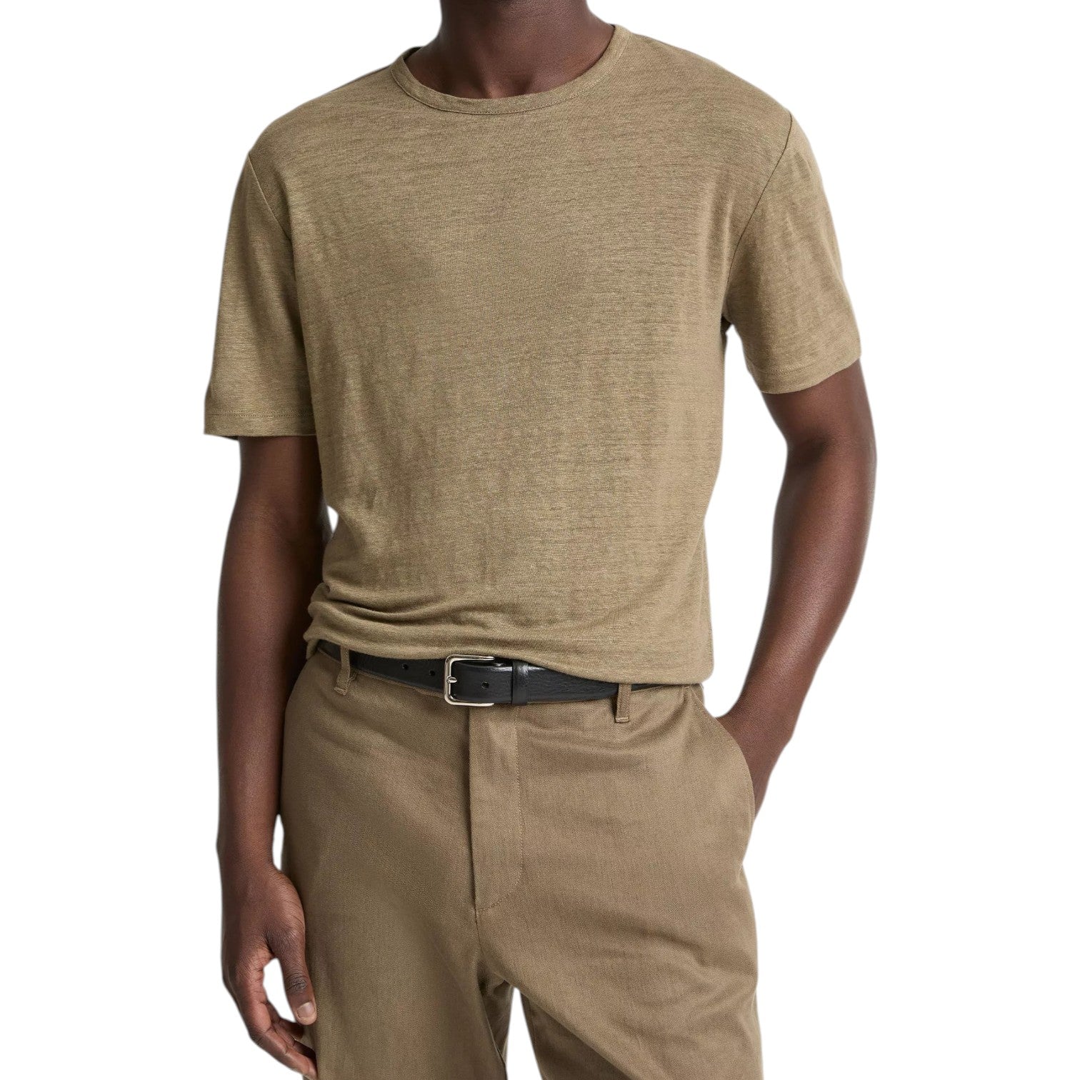 A person wearing the Vince Linen Jersey Shortsleeve Crew in light brown, tucked into matching pants with a black belt.
