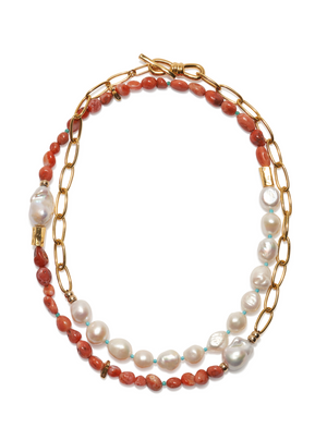 The Porto Covo Necklace by Lizzie Fortunato is a gold-plated chain link necklace with alternating segments of red beads and freshwater pearls, finished with a toggle clasp.