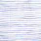 The Timo & Violet Shawl Blanket is made from white organic cotton with thin, hand-drawn blue lines, creating a casual look perfect for a soft shawl or cozy swaddle.