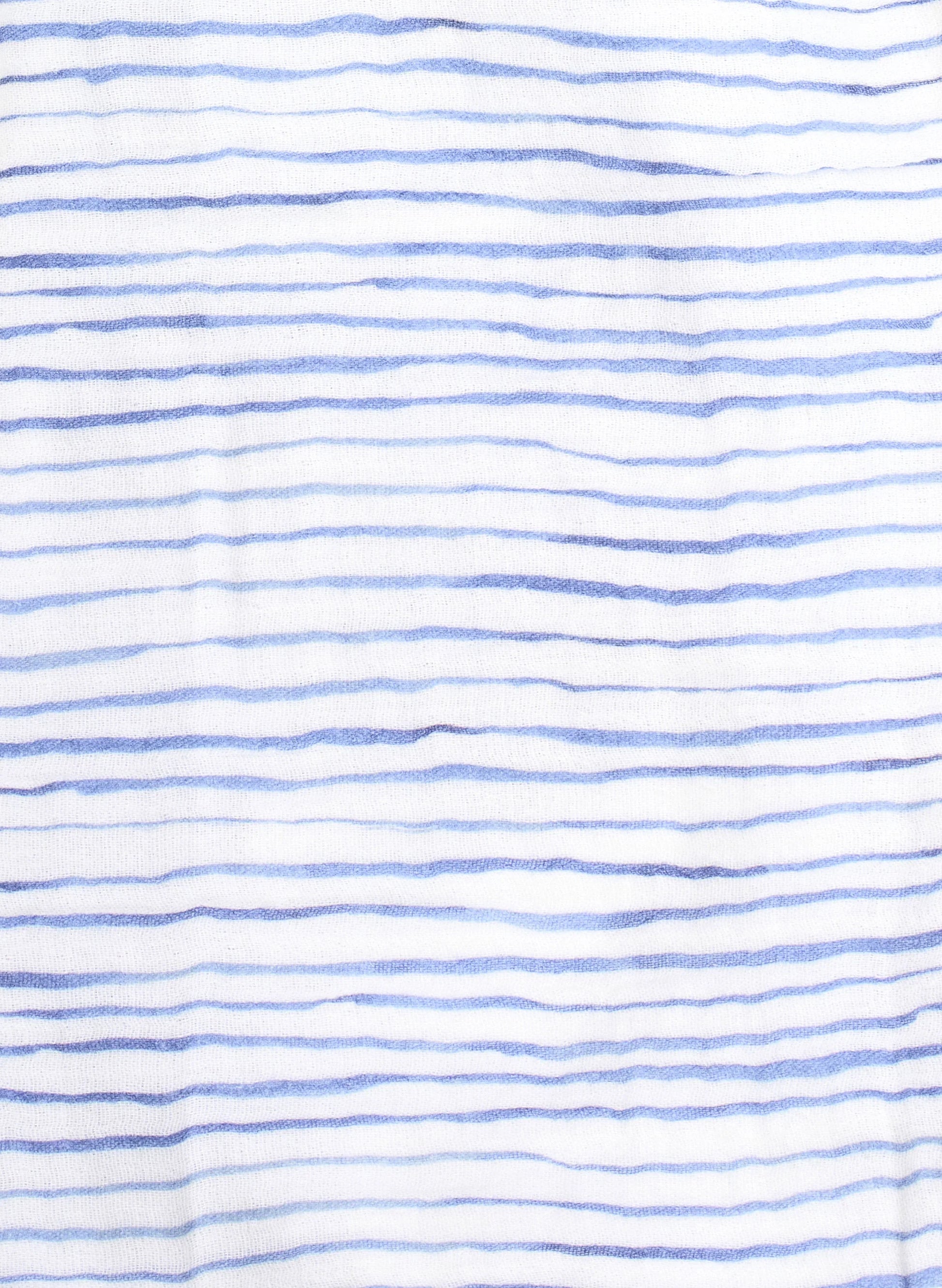 The Timo & Violet Shawl Blanket is made from white organic cotton with thin, hand-drawn blue lines, creating a casual look perfect for a soft shawl or cozy swaddle.