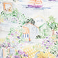 The Timo & Violet Shawl Blanket features a seaside village with colorful houses, sailboats on the water, and flowers and fruit on an organic cotton checkered tablecloth in the foreground.