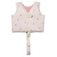 The Sunnylife Kids' Swim Vest in light pink features small strawberry prints, a front zipper, velcro strap, and an anti-rise safety strap that fastens between the legs for a secure fit. It is designed with a neoprene comfort guard to keep your child comfortable while swimming.
