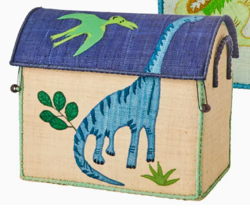 The Rice Raffia Toy Basket is a rectangular storage basket with a blue lid, featuring green dinosaur and pterodactyl embroidery—perfect for dinosaur lovers seeking fun, lidded storage solutions.