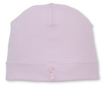 The Kissy Kissy Baby Giraffe Laughs Hat is crafted from soft Pima cotton in a light pink hue, featuring a small embroidered giraffe and delicate scalloped edge detail near the brim.