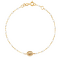 The Gigi Clozeau Madone Charm Bracelet 6.7" by Gigi Clozeau is crafted from 18 carat gold, featuring elegant resin pearls and a central oval medallion.