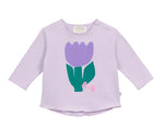 Arsene & Les Pipelettes Baby Girls' Violette Fleur T-Shirt is a light purple, long-sleeve cotton tee featuring a large purple tulip flower with green stem and leaves on the front, crafted from soft, breathable fabric.